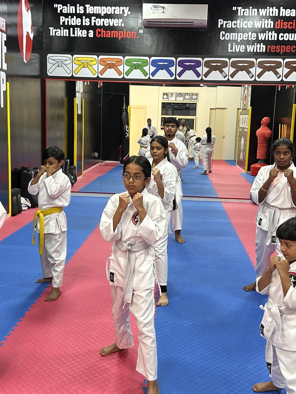 Kids in karate stance training at Al Teneen Al Ahmar