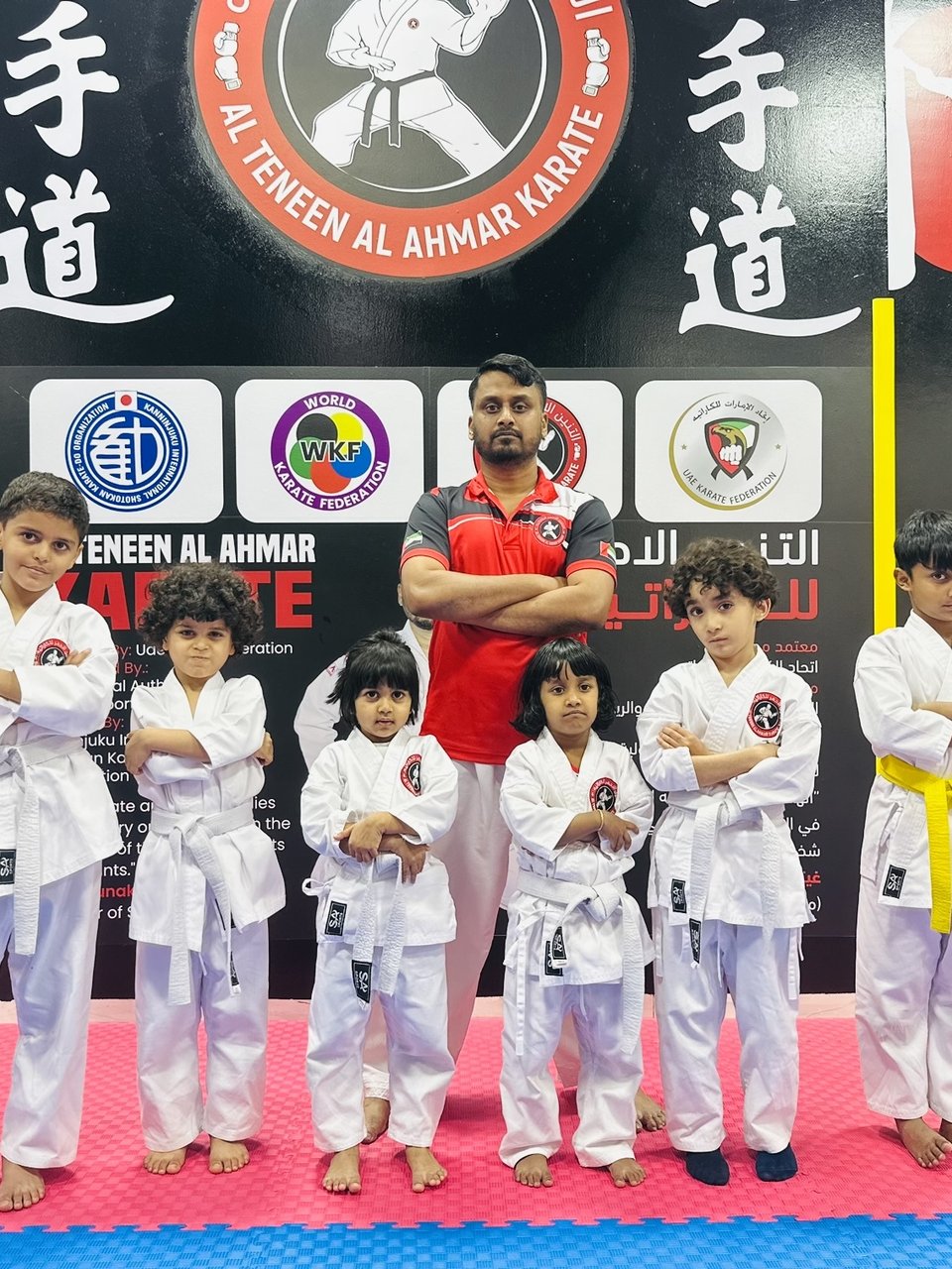 Coach Musthafa with young students at Al Teneen Al Ahmar